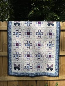 Appliqué butterfly and stars quilt