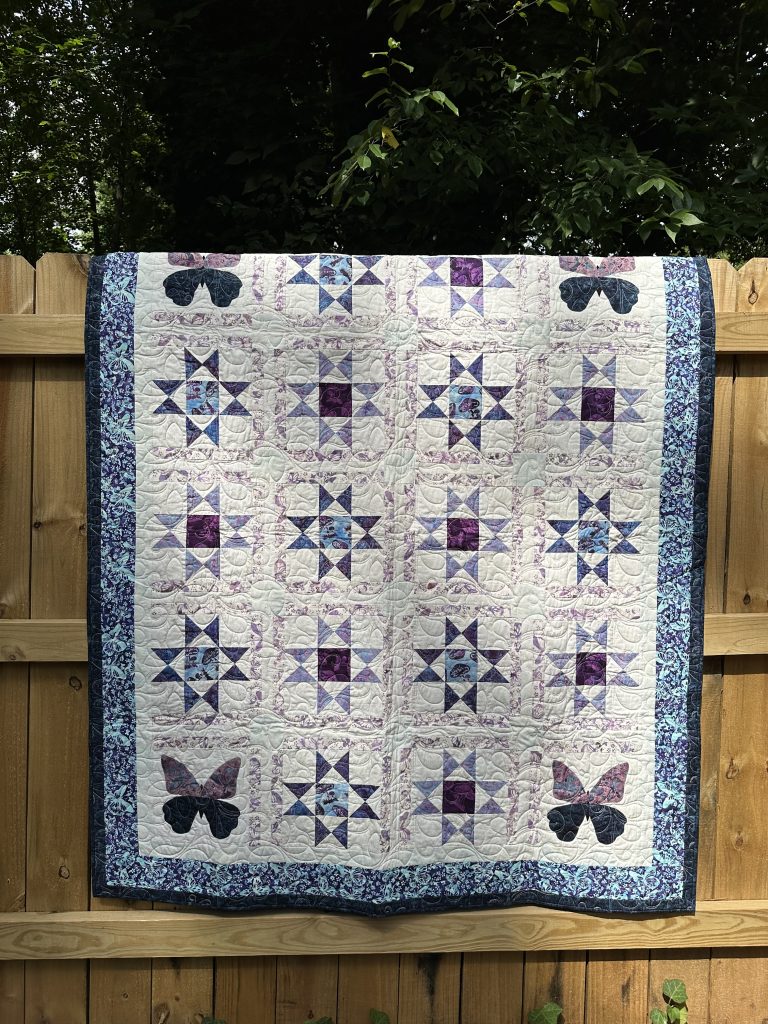 appliqué butterfly and stars quilt