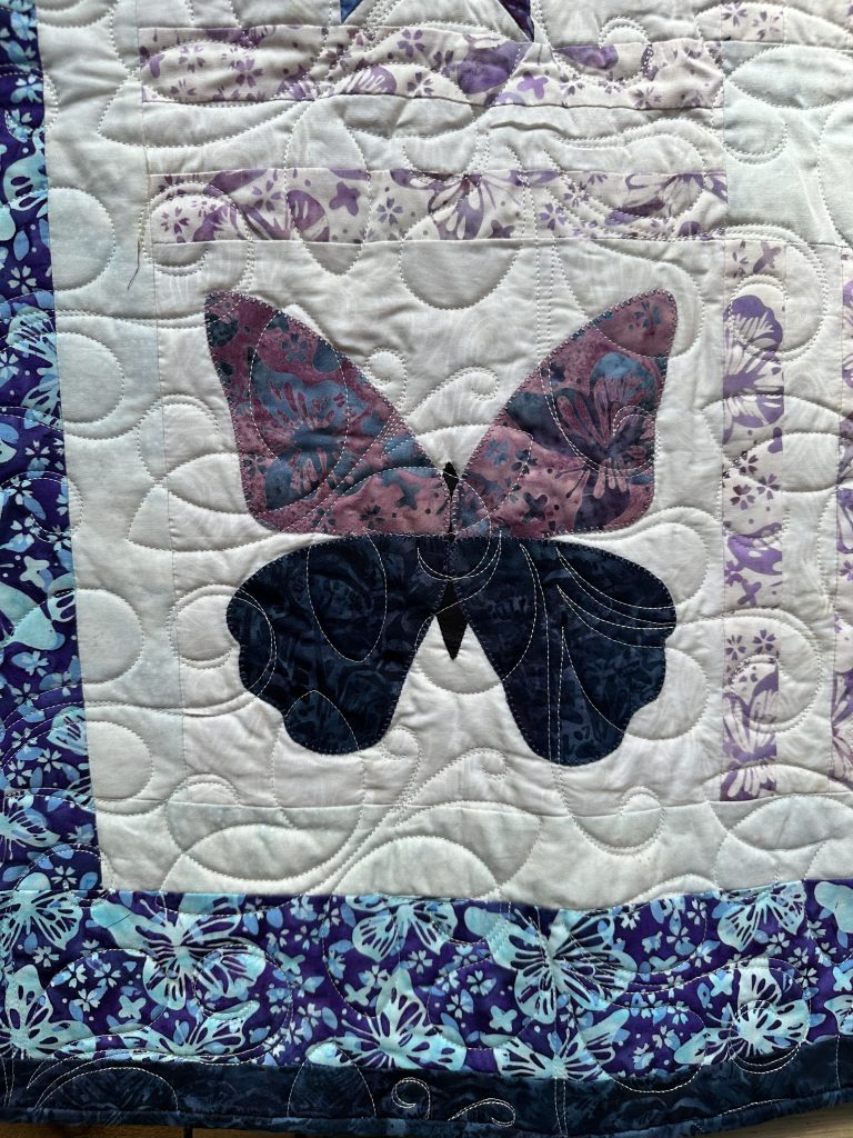 appliqué butterfly and stars quilt